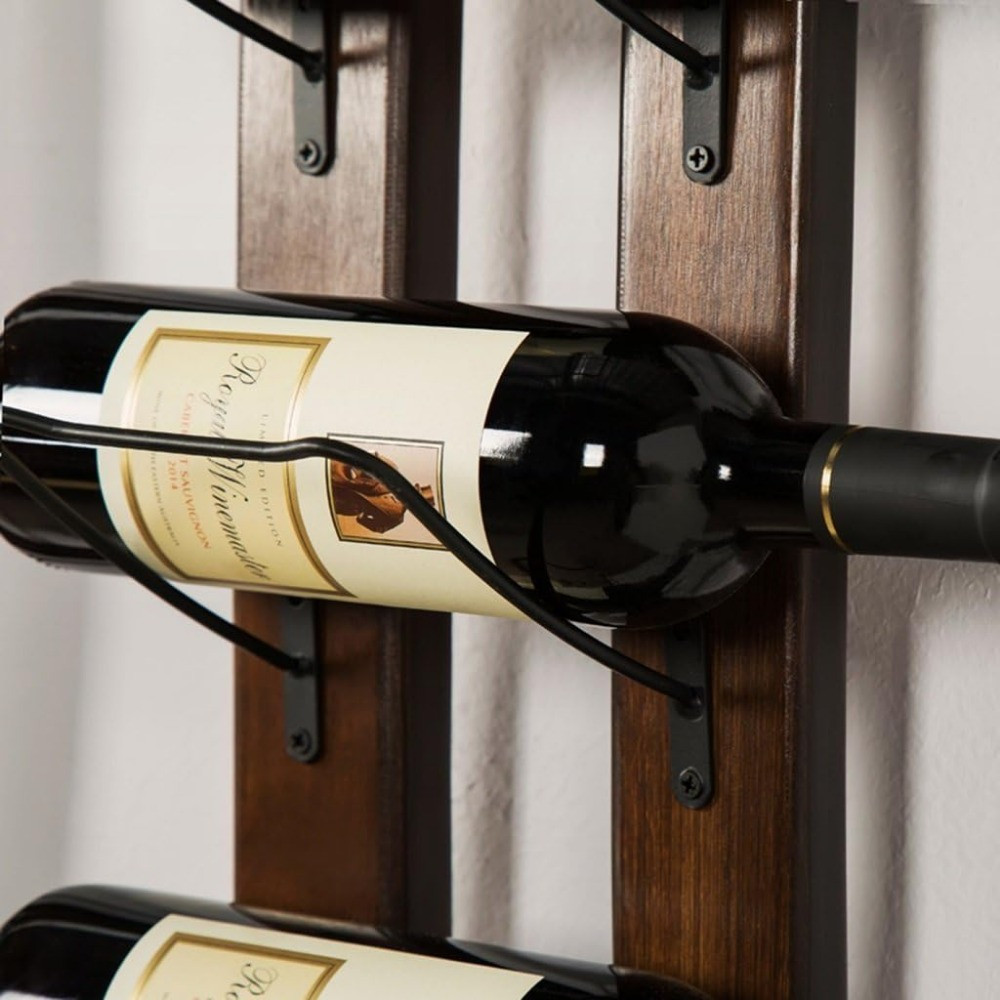 Close-up of a wine bottle mounted on a wooden rack